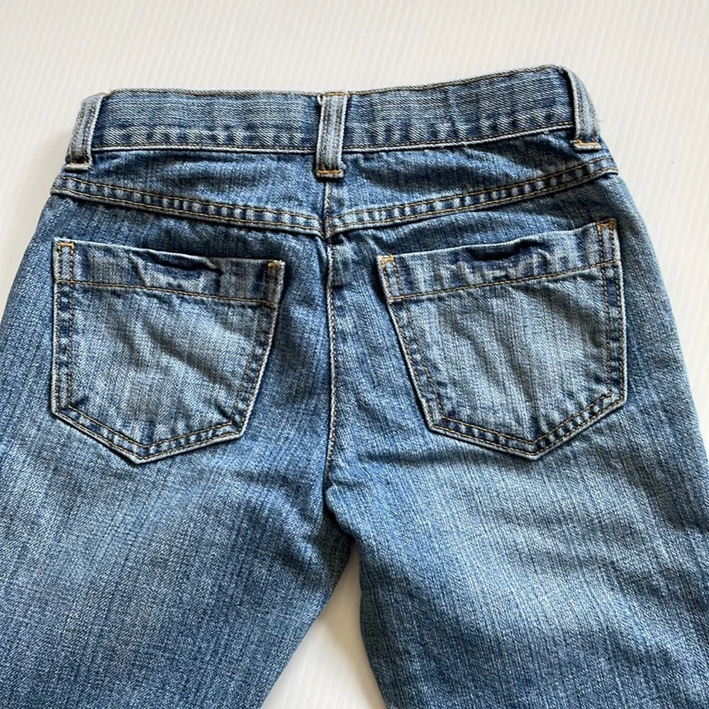 Gymboree flared jeans with gem buttons.  Girls size 7